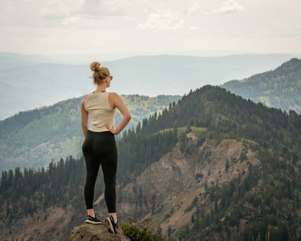 woman on mountain Moving Mountains Through Faith